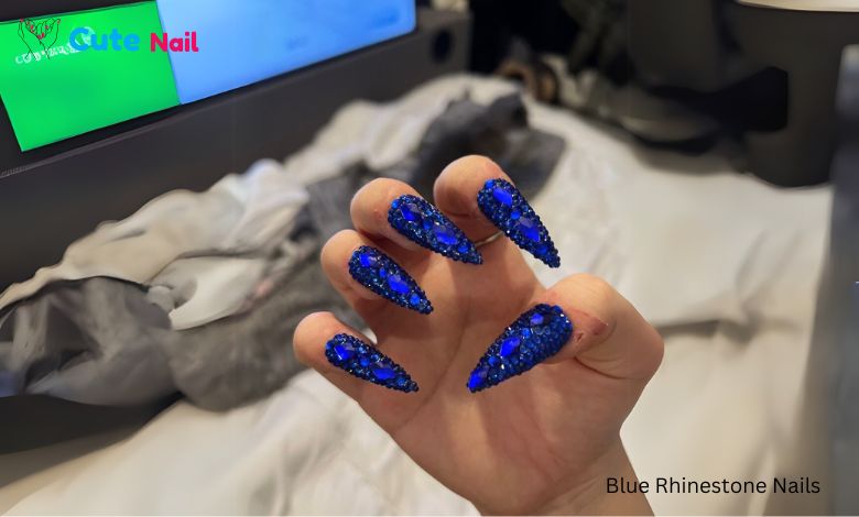 A beautiful woman handed Rhinestone blue Nails